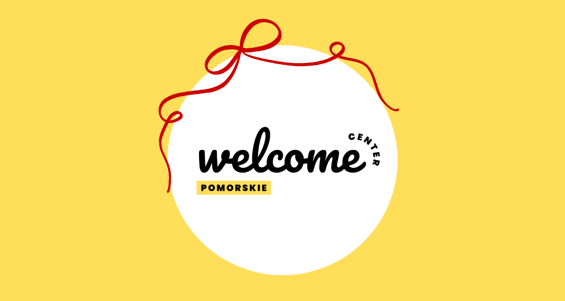 Żółte tło, na nim białe koło. W środku koła czarny napis 